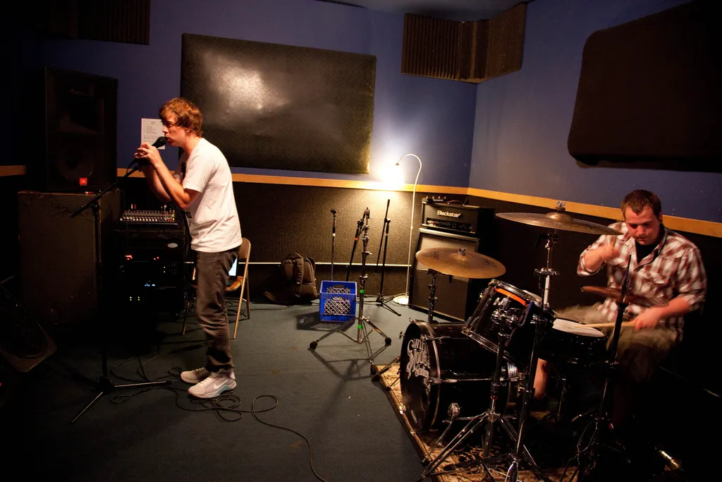 James Bourne singing with the drummer in a rehearsal room